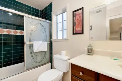 a bathroom with a toilet and a shower and a sink at Mockingbird getaway #2091 in Big Bear Lake