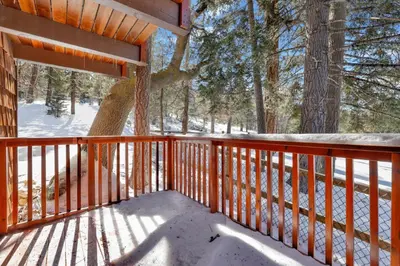 a porch of a cabin with snow on the ground at Smith chalet at snow summit #2278 in Big Bear Lake