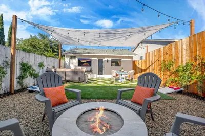 a backyard with a fire pit and two chairs at Cozy Cottage, Brand New, fully Private, walk to Everything in Thousand Oaks