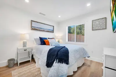 a bedroom with a bed and a window at Cozy Cottage, Brand New, fully Private, walk to Everything in Thousand Oaks