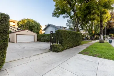 a driveway with a fence and a garage at Free Parking Pasadena Room near Convention Center & Caltech in Pasadena