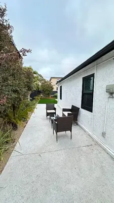 a row of benches sitting next to a building at Modern 2BR Stylish & Cozy Unit in Los Angeles