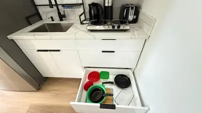 a kitchen with a sink and a white counter top at Modern Studio Stylish &Cozy Back Unit in Los Angeles