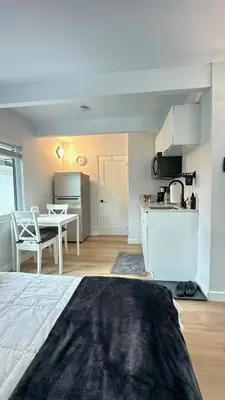 a room with a kitchen and a table and a kitchen at Modern Studio Stylish &Cozy Back Unit in Los Angeles