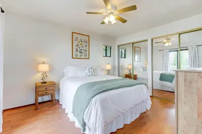a bedroom with a bed and a ceiling fan at Summerland Home with Beach Supplies Walk to Beach! in Summerland