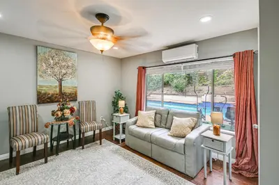 a living room with a couch and a window at Anaheim Studio with Fireplace 14 Mi to Disneyland! in Anaheim