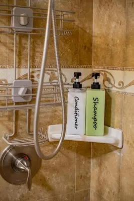 two complimentary toothbrushes on a shelf in a bathroom at Peaceful Family Home with 3 Bedrooms and 2 Bathrooms in Glendora