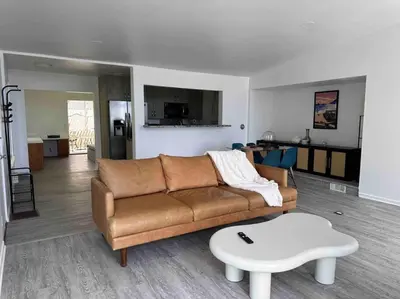 a living room with a couch and a table at 30 PCT OFF!! Limited Time! Malibu Ocean Wave with King Bed, Walking to Beach and Hiking in Malibu