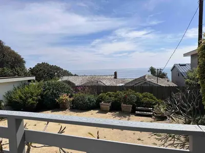 a garden with potted plants and a fence at 30 PCT OFF!! Limited Time! Malibu Ocean Wave with King Bed, Walking to Beach and Hiking in Malibu