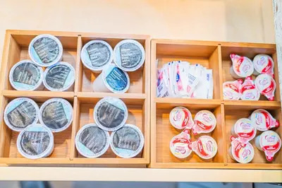 a wooden box filled with different types of shoes at Newly Remodeled 3B2B House in Glendora