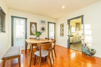 a kitchen and dining room with a table and chairs at Newly Remodeled 3B2B House in Glendora