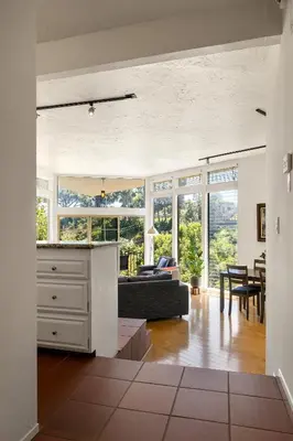 a living room with a couch and a table at Hollywood Hills Retreat w Sweeping Views 2 Bd 2 Bt in Los Angeles