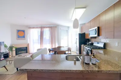 a kitchen and living room with a counter top at Vacation Apartments in Marina Del Rey in Los Angeles