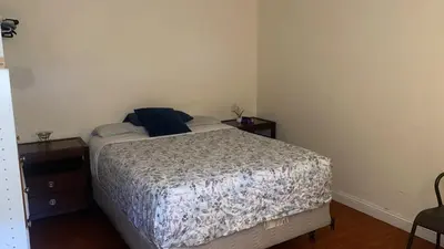 a bedroom with a bed and two nightstands and a bed sidx sidx sidx at Westminster Zen Home in Westminster