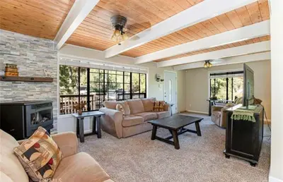 a living room with a couch and a fireplace at Bernina Dr. Retreat in Pine Mountain Club