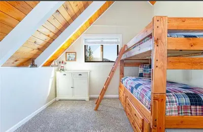 a bedroom with bunk beds in a attic at Bernina Dr. Retreat in Pine Mountain Club
