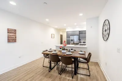 a dining room with a table and chairs at Hollywood Furnished Apartments in Los Angeles