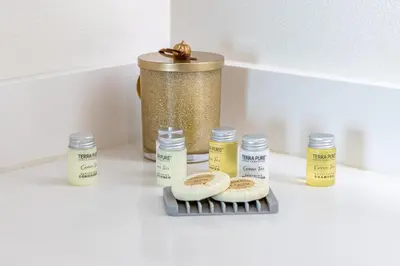 a counter with two bagels on a rack and some vitamins at Hollywood Furnished Apartments in Los Angeles
