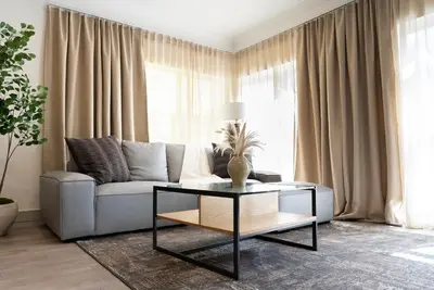 a living room with a couch and a table at Charming 2bd Condo on SunsetStrip in Los Angeles