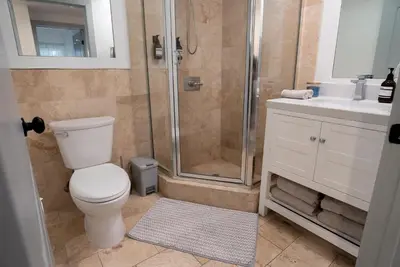 a bathroom with a shower and a toilet and a sink at Charming 2bd Condo on SunsetStrip in Los Angeles
