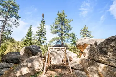 a chair sitting on top of a pile of rocks at Lakeview Lodge - Across the street from the lake and Boulder Bay Park! in Big Bear Lake