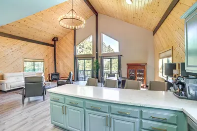 an open kitchen and living room with a couch at Pine Mountain Club Cabin with AandC and EV Charger in Pine Mountain Club