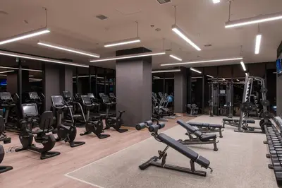 a gym with a lot of treadmills and exercise equipment at City View Suite - DTLA by Monthier in Los Angeles