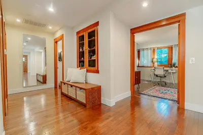 a living room with a couch and a table at Cozy 3 Bedroom Hollywood Home- Quick Walk To All Tourist Spots! in Los Angeles