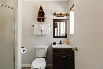 a bathroom with a toilet and a sink at Blissful Bay Cabin in Big Bear Lake