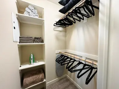a walk in closet with lots of shoes at Stylish 1 Bedroom Apartment in LA with Free Parking - 10 Minutes away from Ceders Sinai in Los Angeles