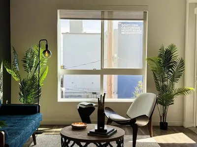 a living room with a couch and a window at Modern Hollywood Home Sunset View & Free Parking - 10mins to Universal Studios in Los Angeles