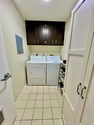 a small kitchen with a washer and dryer at Shared House Hollywood Hideaway Heart of Fame in Los Angeles