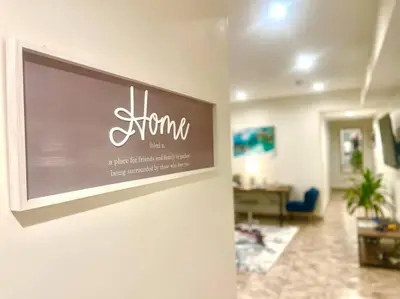 a sign on a wall in a room at FuLLy LoAdeD ReSerVaTioN 3bed 2ba w Parking in Los Angeles