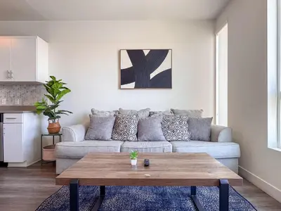 a living room with a couch and a coffee table at Monthier Downtown SA5S1U0 in Los Angeles