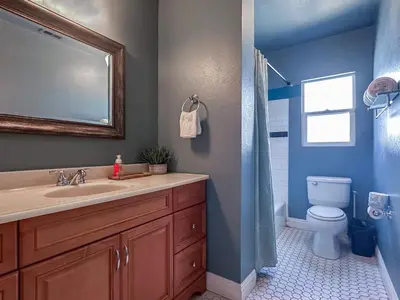 a bathroom with a sink and a toilet and a mirror at Monthier Picfair Village CA1H6O23 in Los Angeles