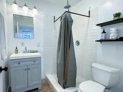 a bathroom with a shower and a toilet and a sink at Monthier Picfair Village CA1G6H23 in Los Angeles
