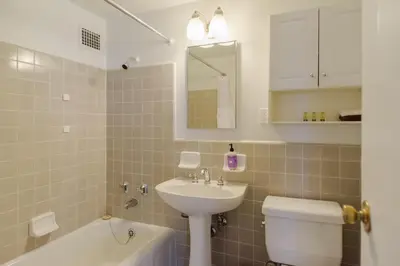 a bathroom with a sink and a toilet and a bath tub at Monthier LACMA SI5T8H57 in Los Angeles