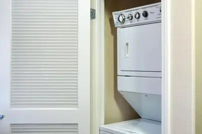 a white oven sitting in a kitchen next to a door at Los Angeles Suite LACMA in Los Angeles