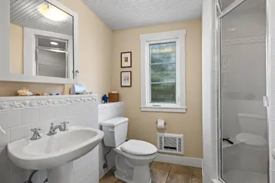 a bathroom with a toilet and a sink and a shower at Sand Side Bliss in Oxnard