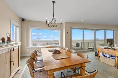 a kitchen and dining room with a table and chairs at Sand Side Bliss in Oxnard