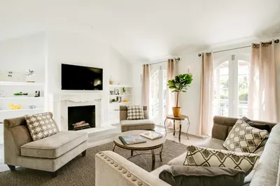 a living room with couches and a fireplace at Monthier Melrose PO7H2O0 in Los Angeles