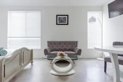 a living room with a couch and a table at Suite Little Tokyo Los Angeles in Los Angeles
