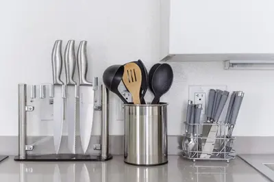 a group of utensils in a can on a kitchen counter at Suite Little Tokyo Los Angeles in Los Angeles