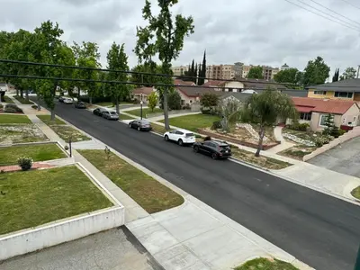 an aerial view of a street with cars on the road at Brand-New Dtla building with rooftop patio in Alhambra