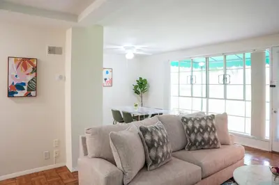 a living room with a couch and a table at Los Angeles Miracle Mile Spacious 2BR Townhouse in Los Angeles