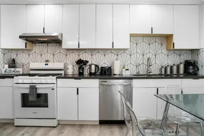 a kitchen with white appliances and a glass table at # Marbella Lane - Serene and Pristine 2BR Home in West Covina