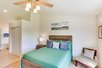 a bedroom with a bed and a ceiling fan at Victorville Home with Large Yard and Charcoal Grill! in Victorville