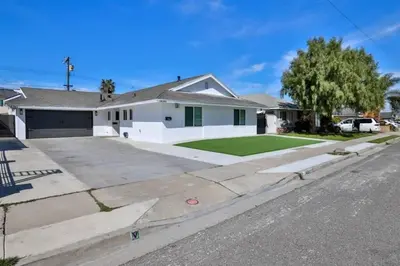 a house on a street with a driveway at H&H New Built 2023 Hidden Gem Heart of OC 3 Queen Beds in Westminster