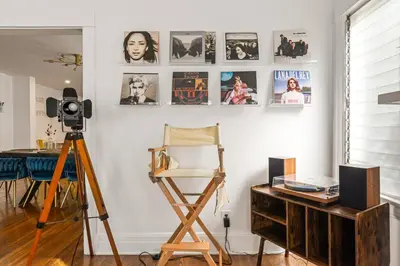 a room with a tripod and a camera and a desk at Los Angeles charming big house, king bed, parking, EV in Los Angeles
