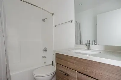 a bathroom with a sink and a toilet and a shower at Blueground Hollywood gym near Walk of Fame LAX-1217 in Los Angeles